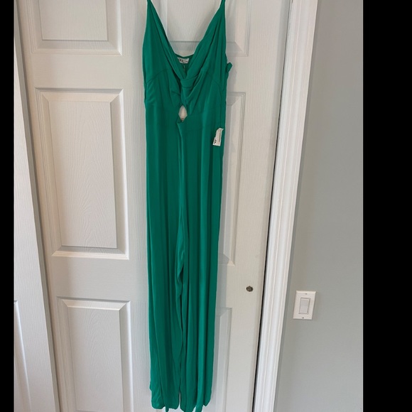 Pants - NWT! Green jumpsuit with cutout in front
